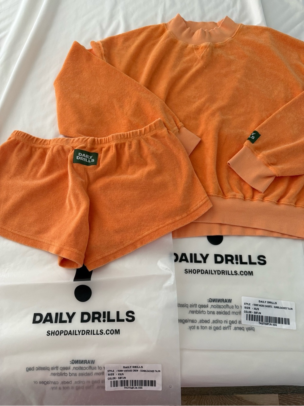 Daily Drills terry mock crew and matching micro mini terry shorts. Both are xs/